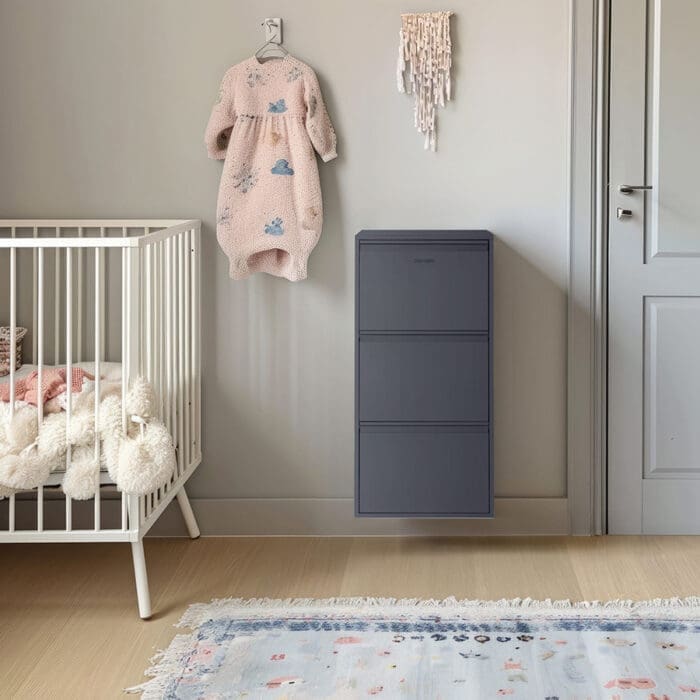 Closed dark grey Trinity Casa Dora steel storage cabinet neatly positioned against the nursery wall, serving as an organised storage solution for baby essentials
